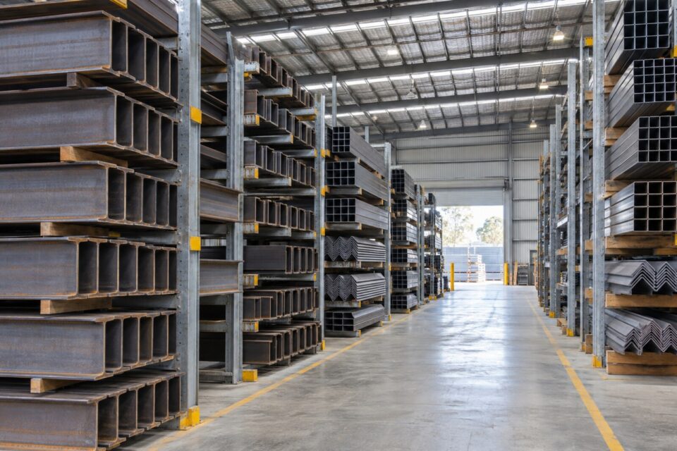 Steel beams, channels, angles and hollow sections organised in warehouse racks